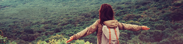 Traveler with Backpack looking at Brisbane bush land in South East Queensland