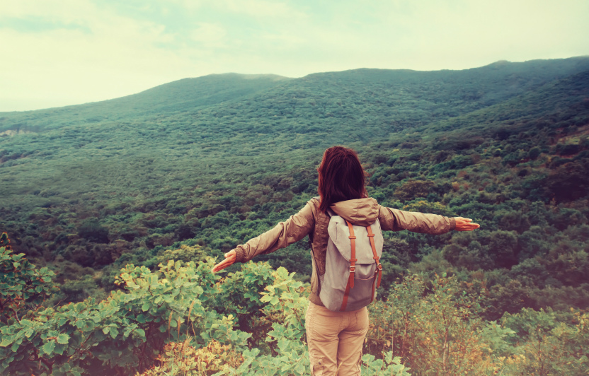 overseas tourist looking at Australian forest from top of mountain whilst on holiday staying at a Oaks Hotels and Resorts apartment