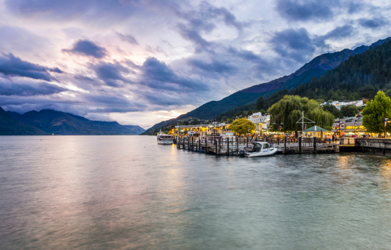 Sun setting in winter over Lake Wakatipu near Oaks resort accommodation Queenstown, New Zealand