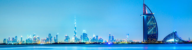 view of Dubai hotels and city skyline at sunrise from private balcony of Oaks Liwa Heights hotel holiday apartment