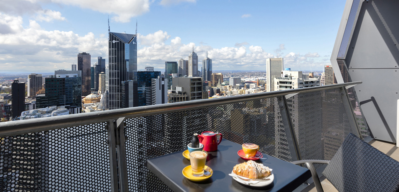 Oaks On William Official Website Serviced Apartments In Melbourne Tea Cups Coffee Mug And Crumpets On Table Private Balcony Of Serviced Apartments In